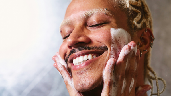A Man Using A Facial Cleanser As The First Step In His Routine