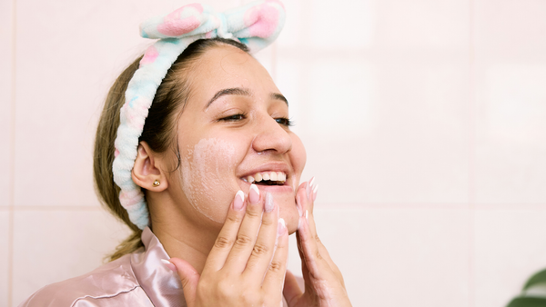 A Woman Applying Cleanser For Combination Skin
