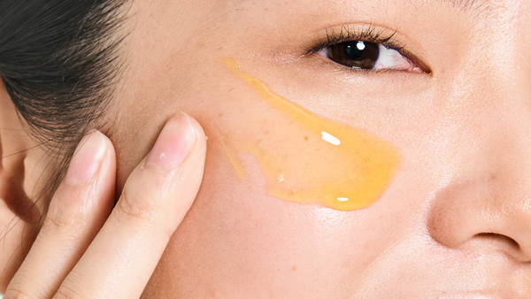  Woman Applying Gold Standard Exfoliation Treatment