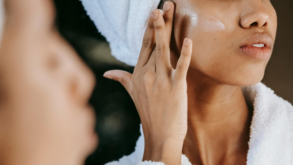 A Woman Applying Moisturizer For Skin Barrier Repair