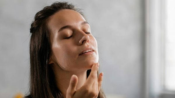 Woman Applying Moisturizer With Panthenol For Skin