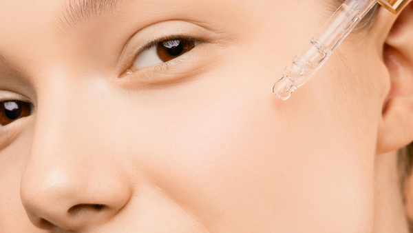 Woman’s Face Using Retinol Before Or After Moisturizer